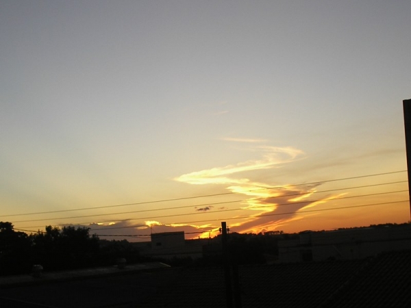 Pr-do-sol com nuvem espiral em Campo Mouro Pr.