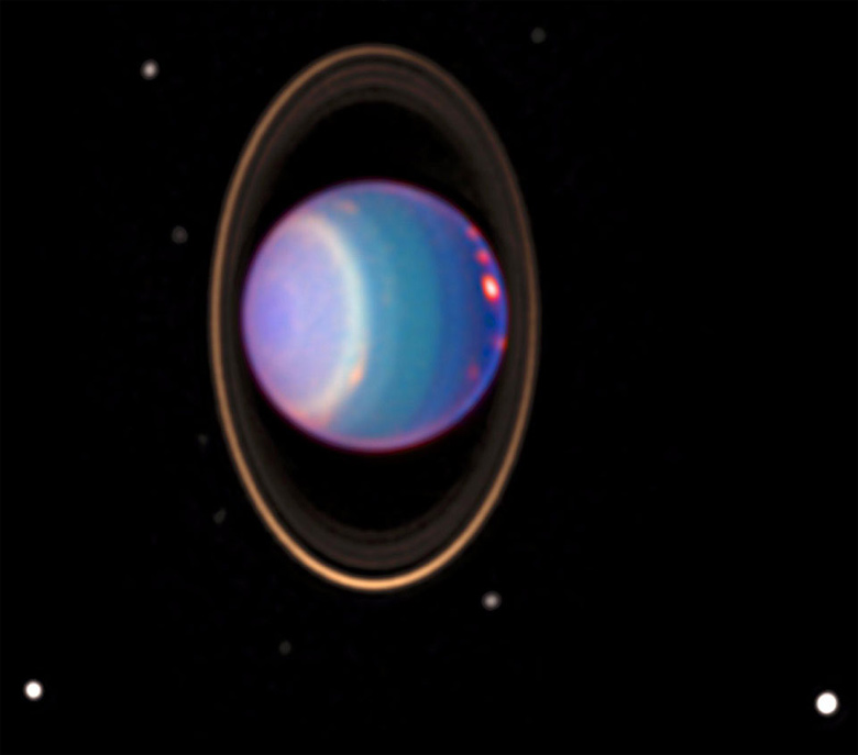 Urano é orbitado por quatro anéis principais e 27 luas. O novo estudo sugere que quatro dessas Luas podem manter um oceano líquido abaixo da crosta. Foto: NASA